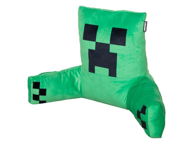Coussin de dossier de jeu vert avec un motif de visage pixelisé noir, ressemblant à un personnage de jeu populaire.