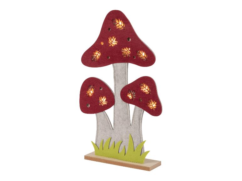 Lampes champignons en feutre avec feuilles découpées.