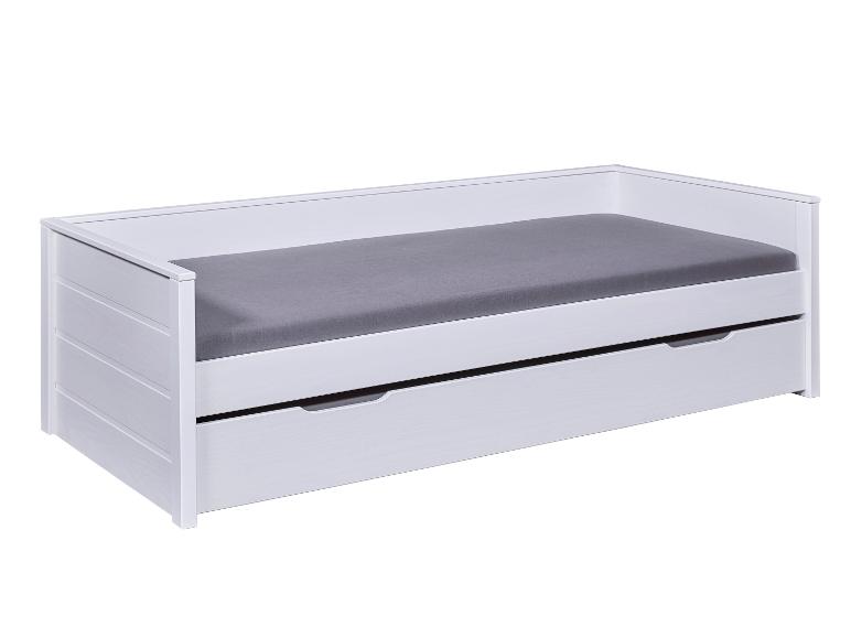 Lit d'enfant blanc avec tiroir de rangement.