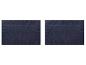 Deux tapis de bain bleu marine avec un motif de bordure texturé.