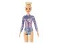 Poupée Barbie avec un justaucorps de gymnastique scintillant.