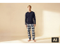 Homme en pyjama avec un t-shirt bleu marine et un pantalon à carreaux.