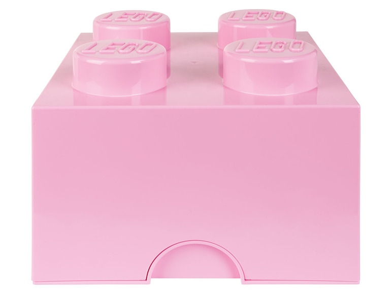 Une boîte de rangement LEGO rose avec quatre briques LEGO sur le dessus.
