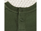 Un pull vert avec des boutons