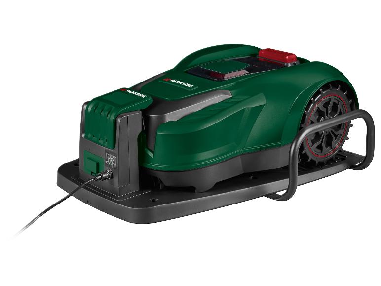 Tondeuse robot verte et noire avec câble de chargement, sur fond blanc.