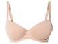 Un soutien-gorge beige avec des bonnets lisses.