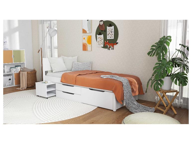 Lit enfant blanc avec tiroirs et table de chevet.