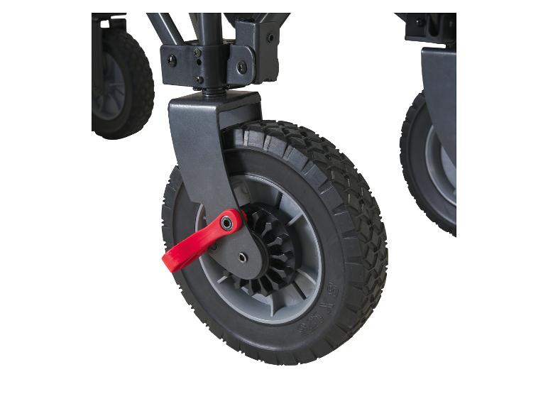 Gros plan d'une roue de chariot noire avec un levier de frein rouge