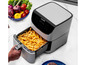 Une friteuse à air Cosori avec des frites.