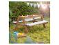 Table de pique-nique en bois pour enfants avec deux bacs à sable/eau et coussins étoilés.