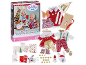 Calendrier de l'avent de Noël avec poupée, vêtements et accessoires festifs.