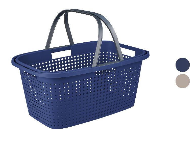 Panier et corbeille à linge en plastique bleu avec poignées.