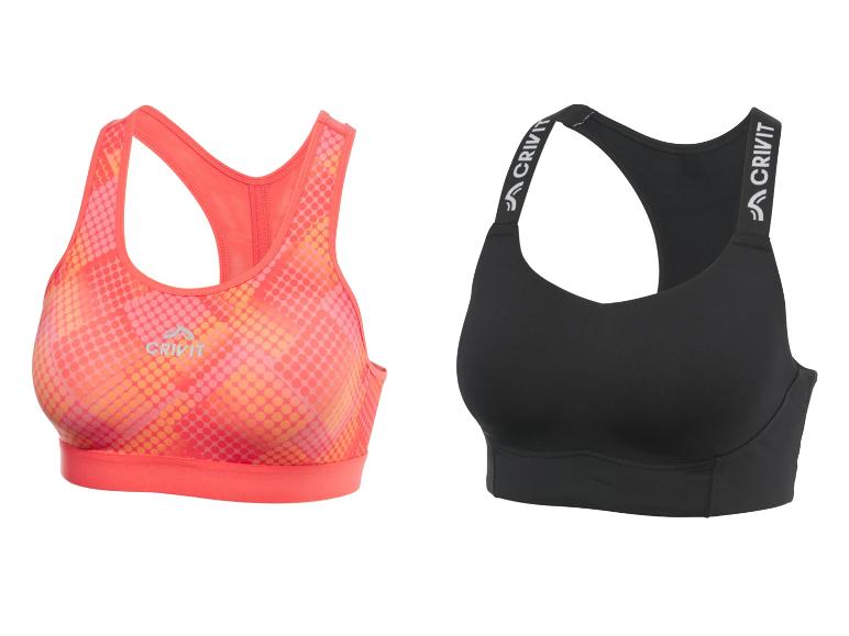 Deux soutiens-gorge de sport Crivit : un corail à pois et un noir.