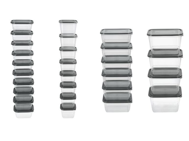 Ensemble de boîtes alimentaires transparentes avec couvercles gris, empilées.