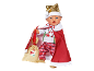 Poupée de Noël avec bonnet doré, cape rouge et sac de cadeaux.
