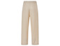 Pantalon beige à jambes larges.