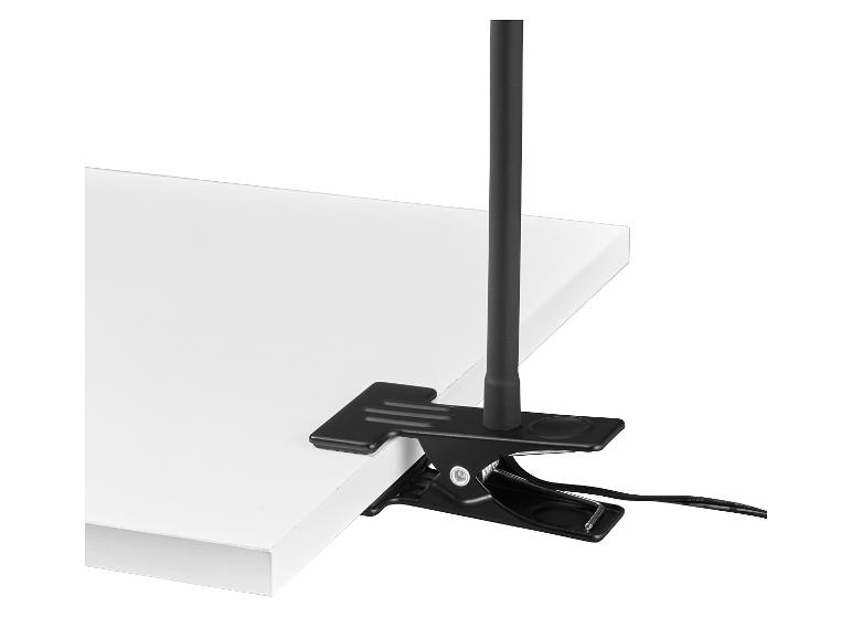 Pince de fixation noire avec tige et câble, attachée à une surface blanche.