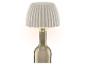 Lampe de table avec abat-jour plissé, montée sur une bouteille en verre.