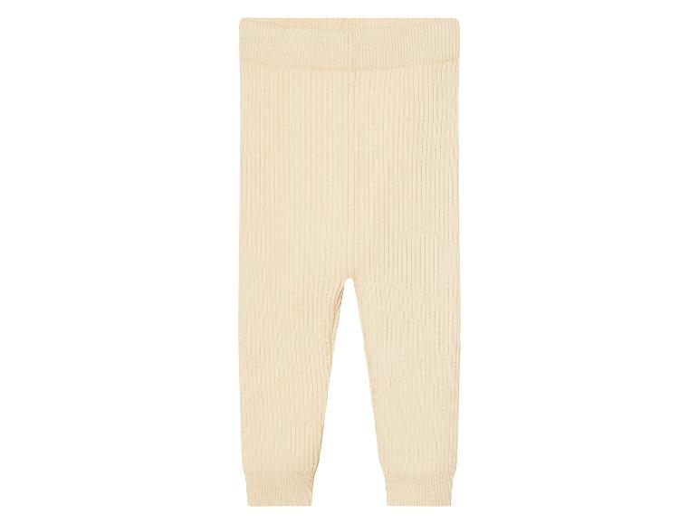 Leggings bébé en tricot côtelé beige.