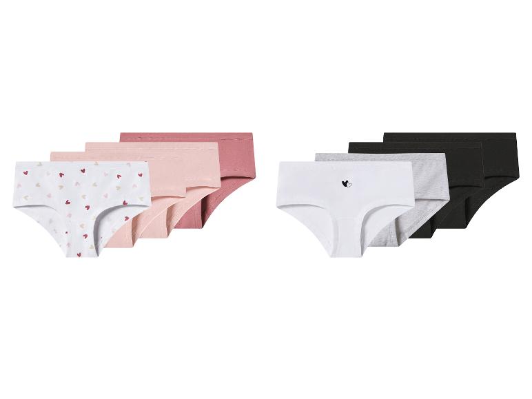 Lot de culottes pour filles en rose, blanc, gris et noir, certaines avec des motifs de cœurs.