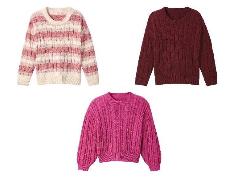 Trois pulls en maille rose, bordeaux et rose foncé.