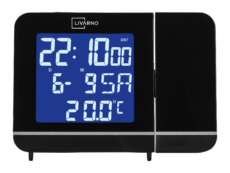 Réveil numérique LIVARNO avec écran bleu, affichant l'heure, la date et la température, sur fond blanc.
