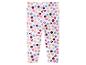 Legging blanc à pois multicolores et têtes de personnage de dessin animé.