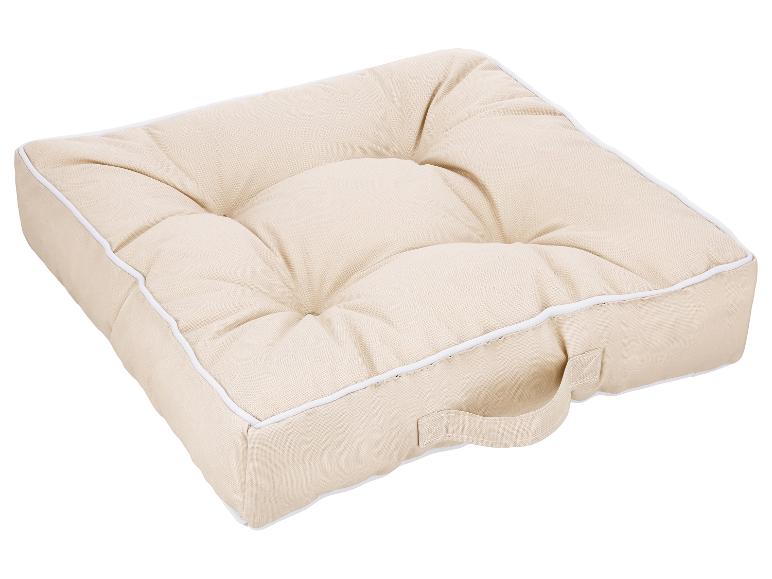 Coussin de siège carré beige avec poignée et passepoil blanc.