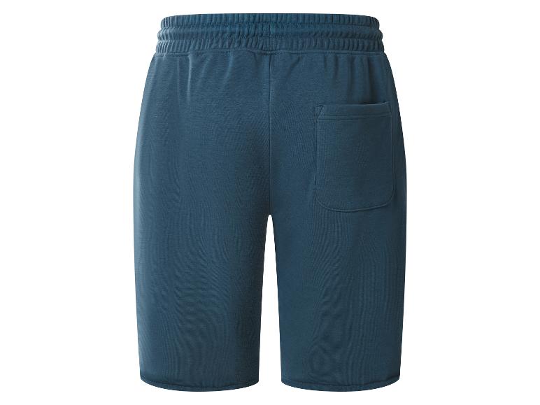 Shorts en jersey bleu foncé pour homme avec taille élastique et poche arrière.