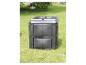 Composteur de jardin noir sur herbe verte