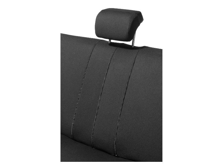 Siège auto noir avec appuie-tête réglable.