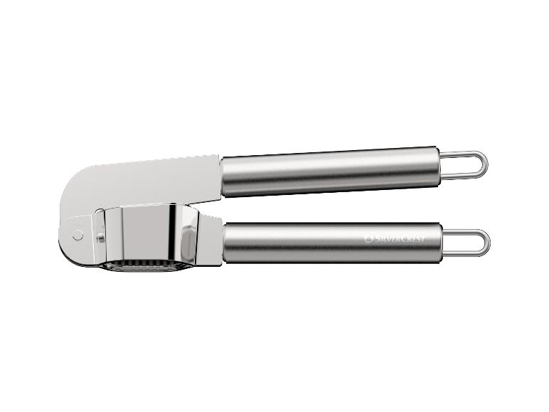 Presse-ail en acier inoxydable avec poignées ergonomiques.