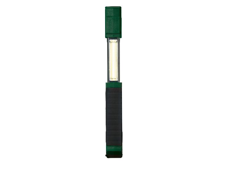 Une lampe de travail LED verte avec une base magnétique.