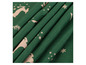 Tissu vert avec un imprimé de cerfs et d'étoiles