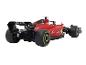 Une voiture de course de Formule 1 Ferrari rouge avec des sponsors comme Velas, V-Power et Santander.