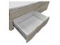 Lit coffre avec tiroir de rangement ouvert et surmatelas blanc.