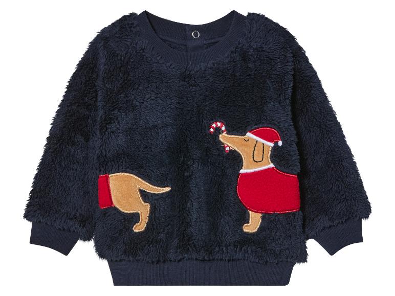 Un sweat en polaire bleu marine avec un motif de chien de Noël.