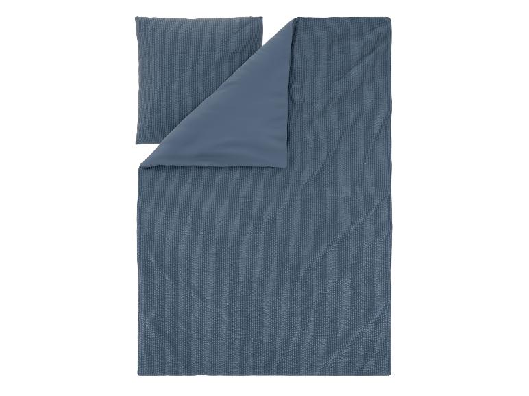 Parure de lit bleu foncé avec housse de couette et taie d'oreiller à motif rayé subtil.