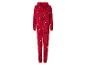 Une combinaison rouge à motif de Noël, avec des rennes et des cannes en sucre.