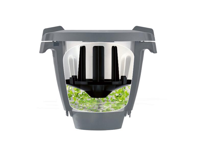 Coupe-légumes et réservoir à déchets : vue intérieure du processus de découpage.