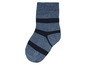 Une chaussette bleue avec des rayures noires.