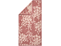 Serviette rose avec motif floral plus clair, pliée à un coin.