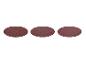 Trois disques abrasifs ronds de couleur marron sur fond blanc