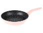 Une poêle rose avec une surface marbrée.