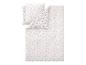 Parure de lit avec motif floral dans les tons beige et blanc.