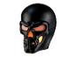 Masque de crâne noir lumineux avec des yeux et une bouche orange et jaunes.