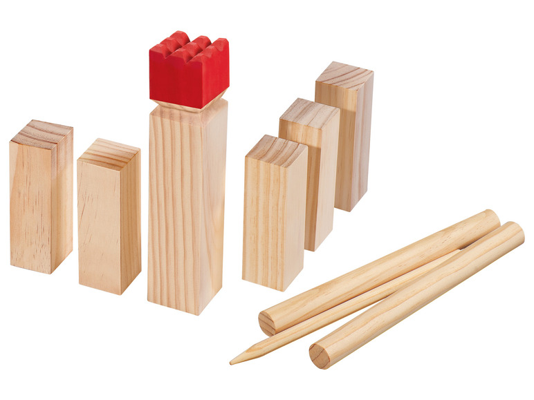Un jeu de blocs en bois avec des tours rouges et des bâtons pour les renverser.