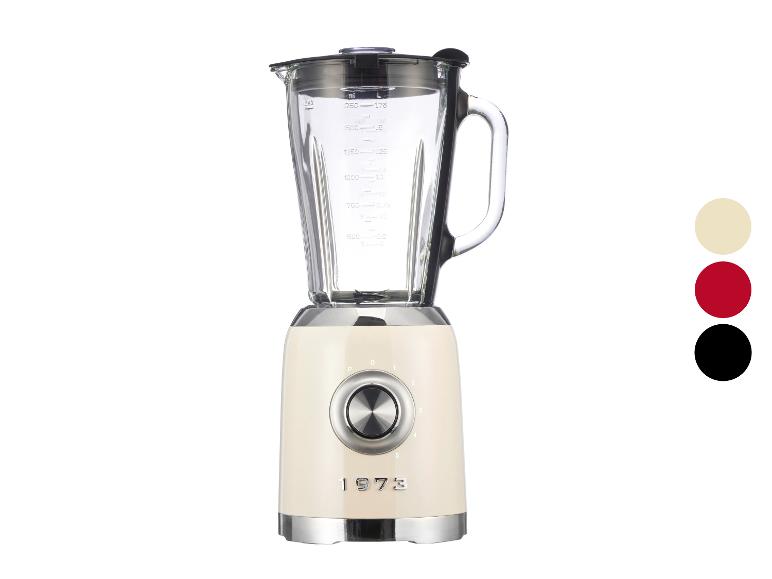 Un blender rétro 1973 couleur crème avec un bol en verre et plusieurs vitesses.