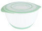 Un bol à mélanger vert et blanc avec un couvercle.