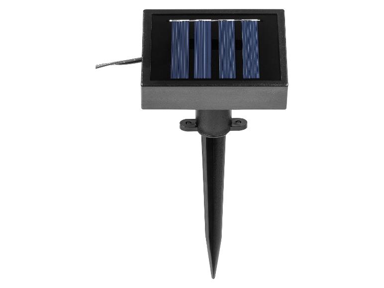 Panneau solaire noir avec piquet pour éclairage extérieur.